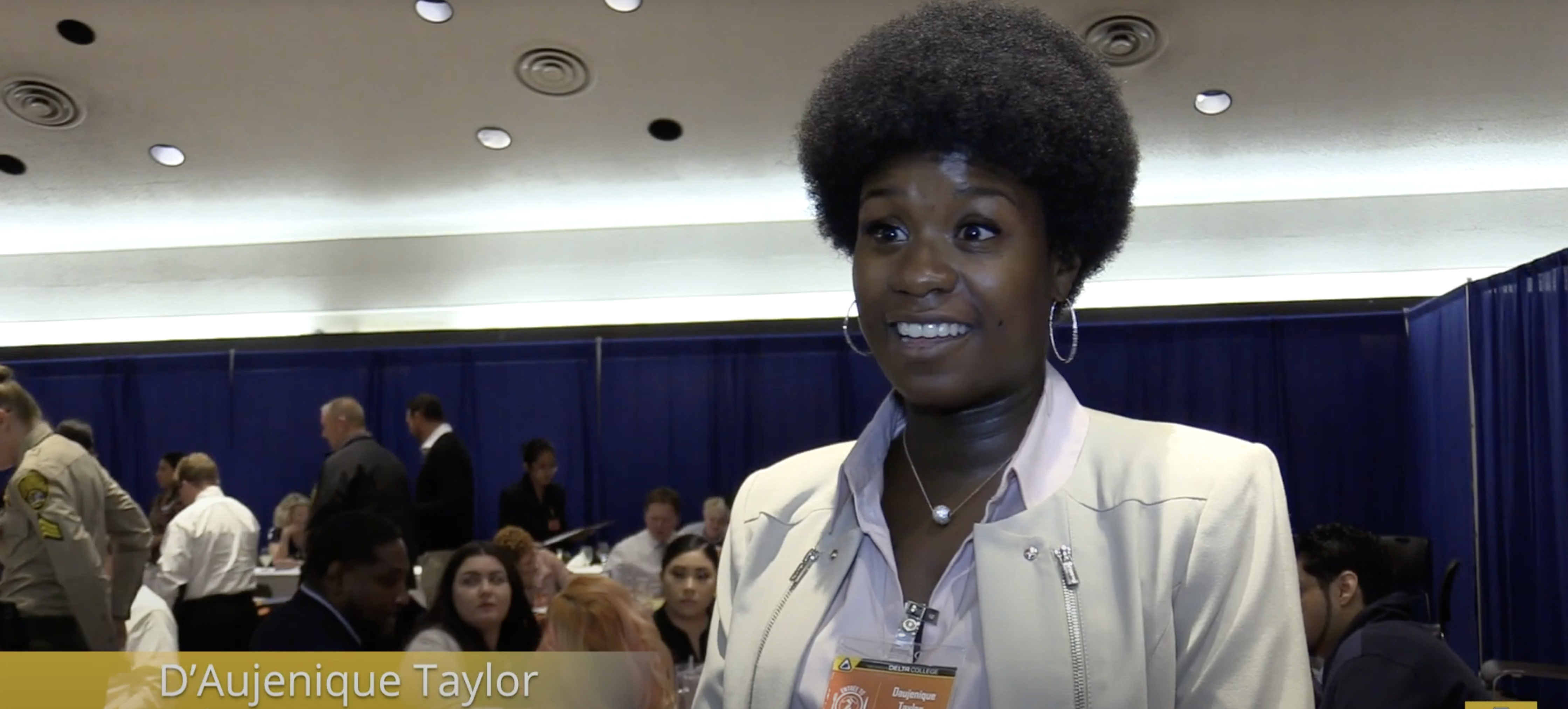 Student speaking to camera at event