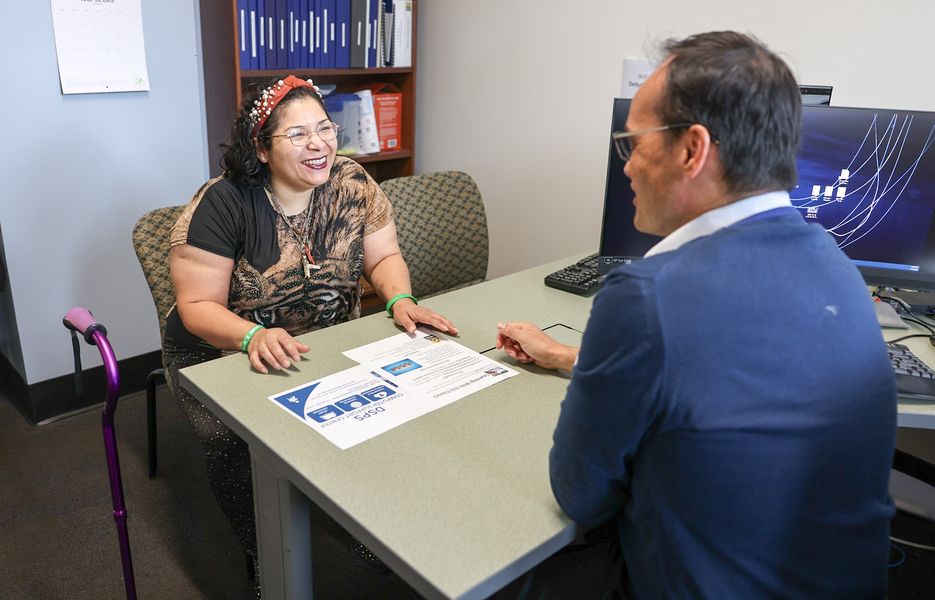 A student gets assistance from a DSPS faculty member