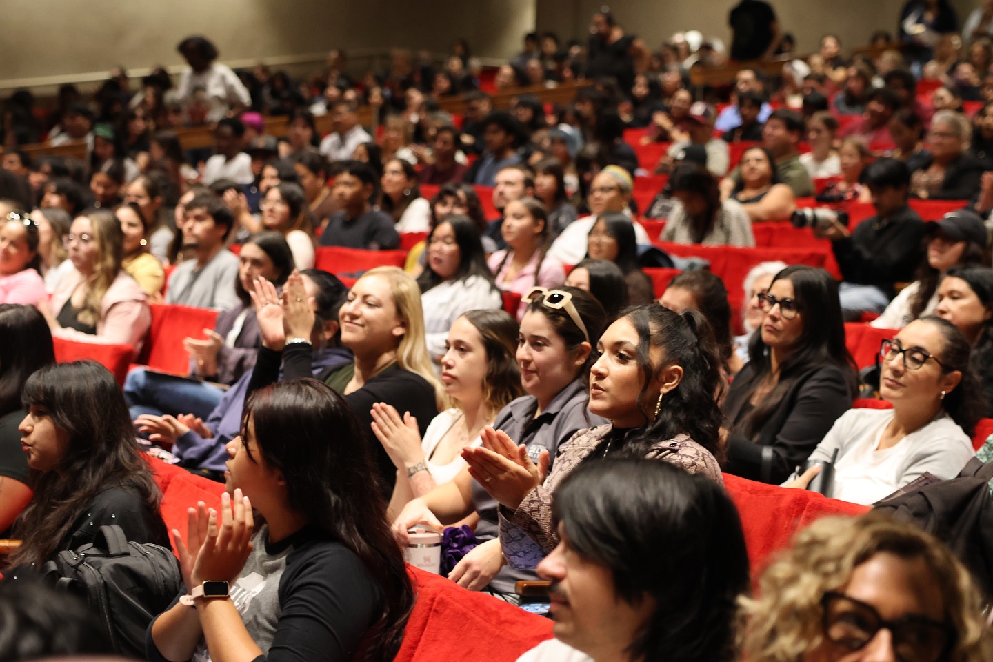 Photo of students and community members watching Dolores Huerta speak