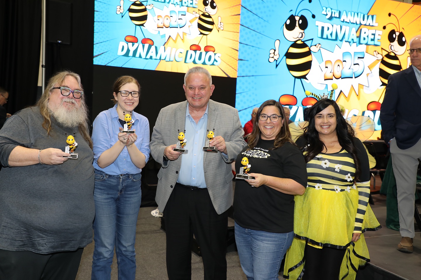 Delta College Trivia Bee contestants hold their prizes.