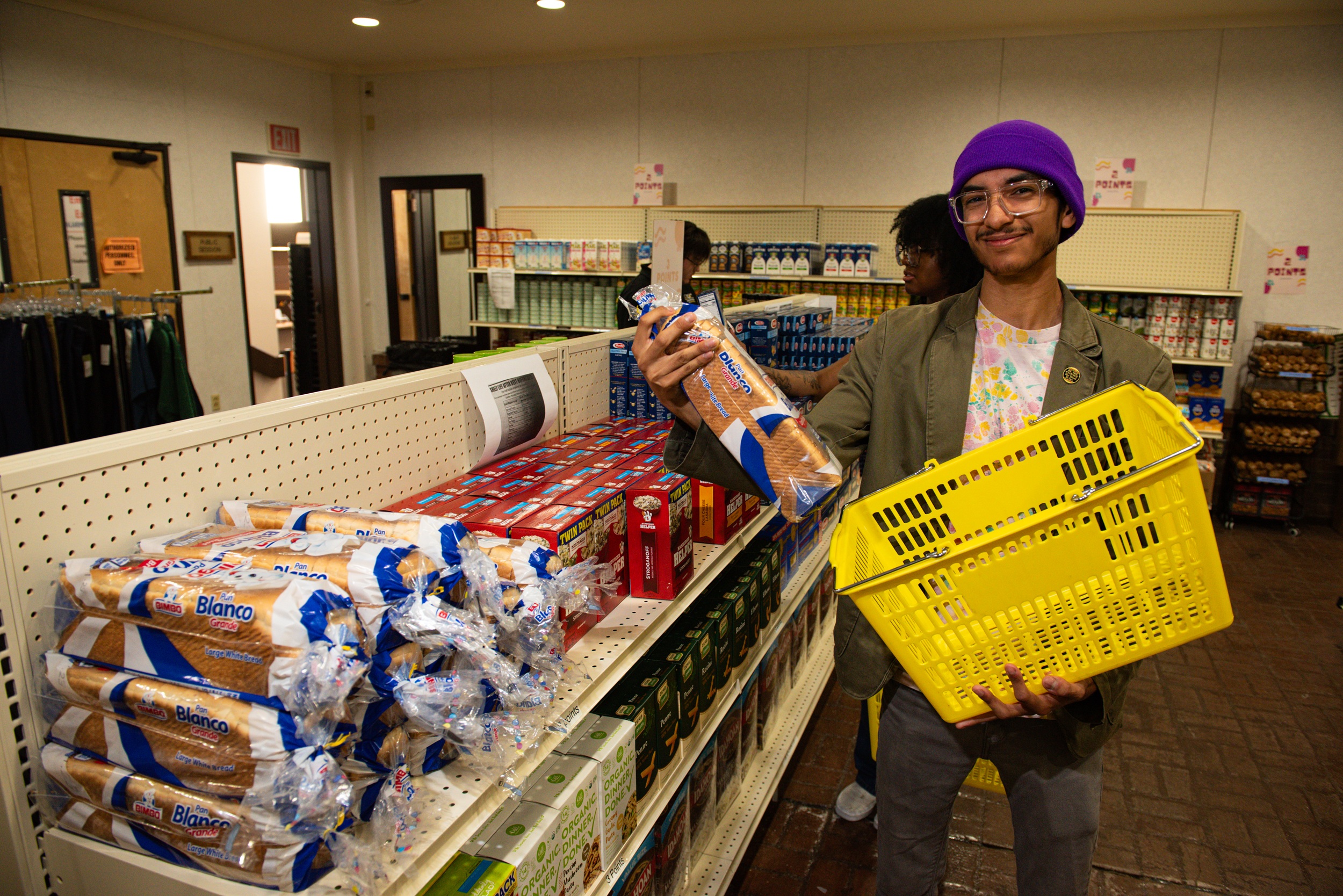 Photo of a student getting bread at the Student Food Pantry
