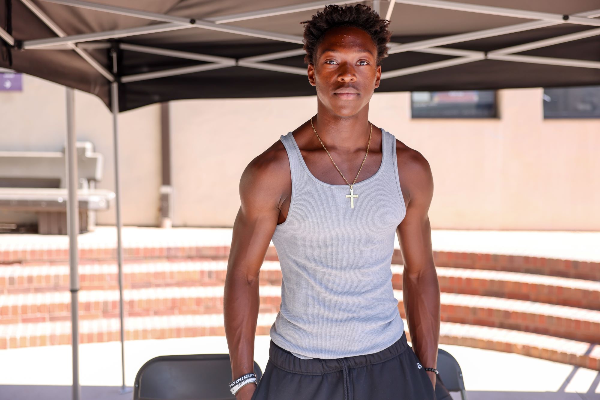 Student smiling while tabling at Club Rush event