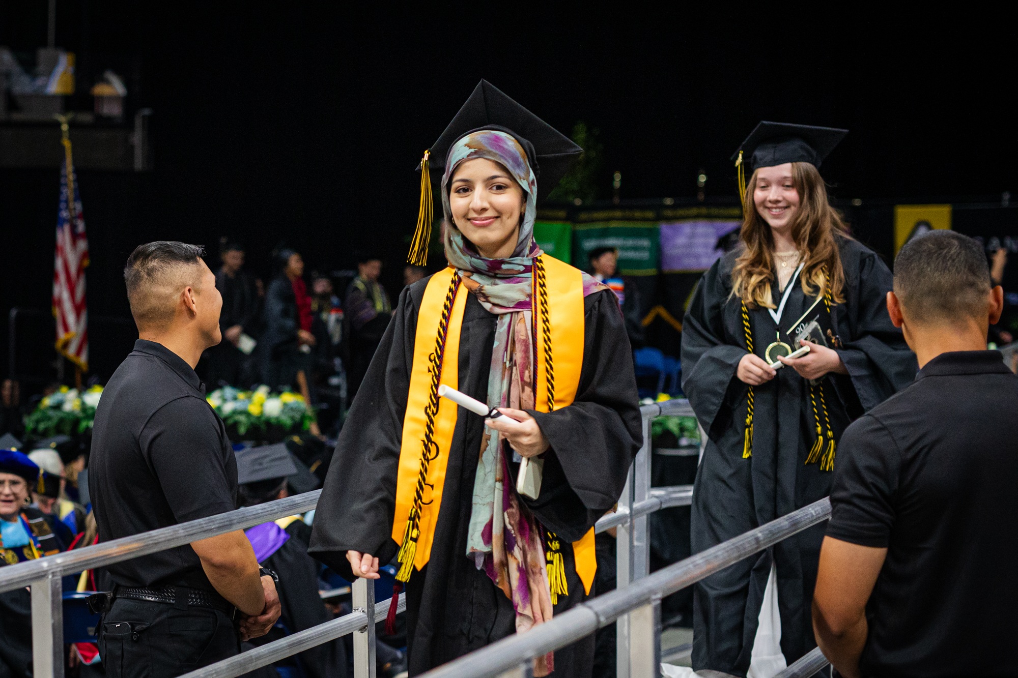 A gradute receives her scroll