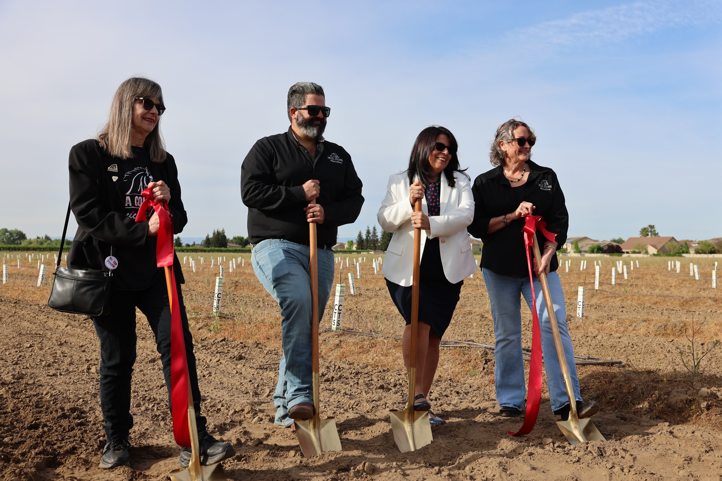 Photo after ribbon cutting at new cherry orchard