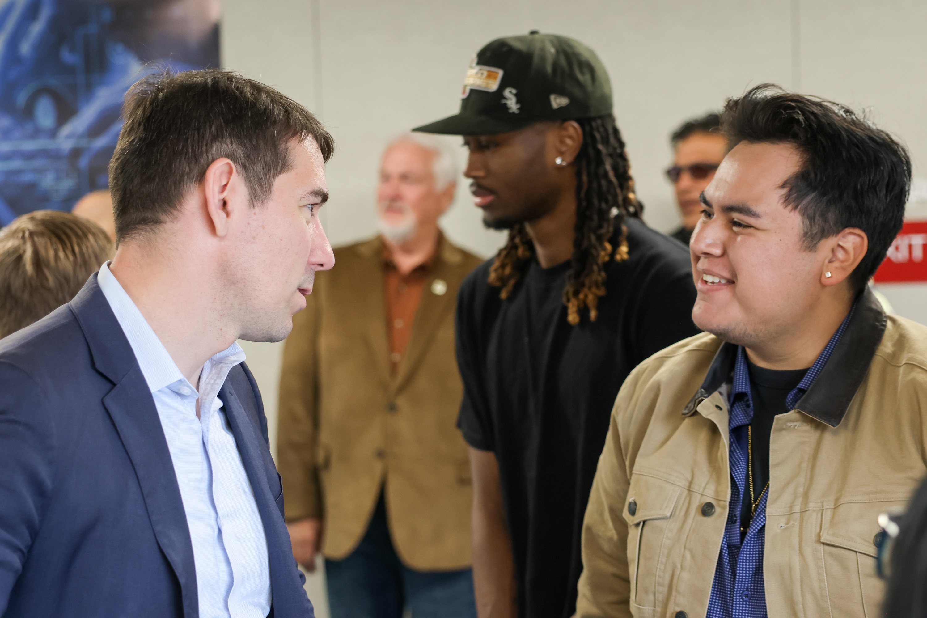 Photo of Congressman Josh Harder speaking with Delta's student trustee