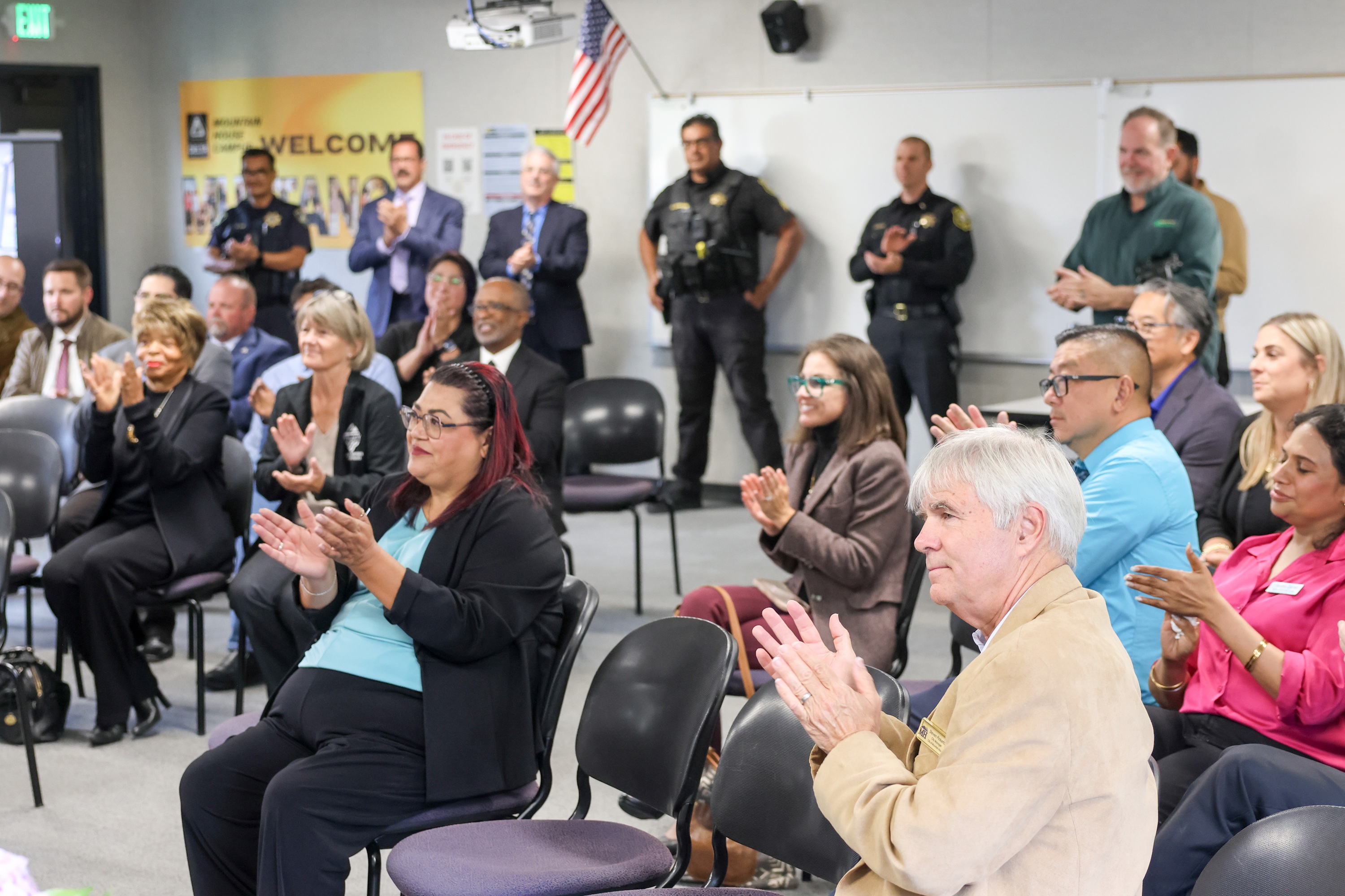 Photo of community members applauding
