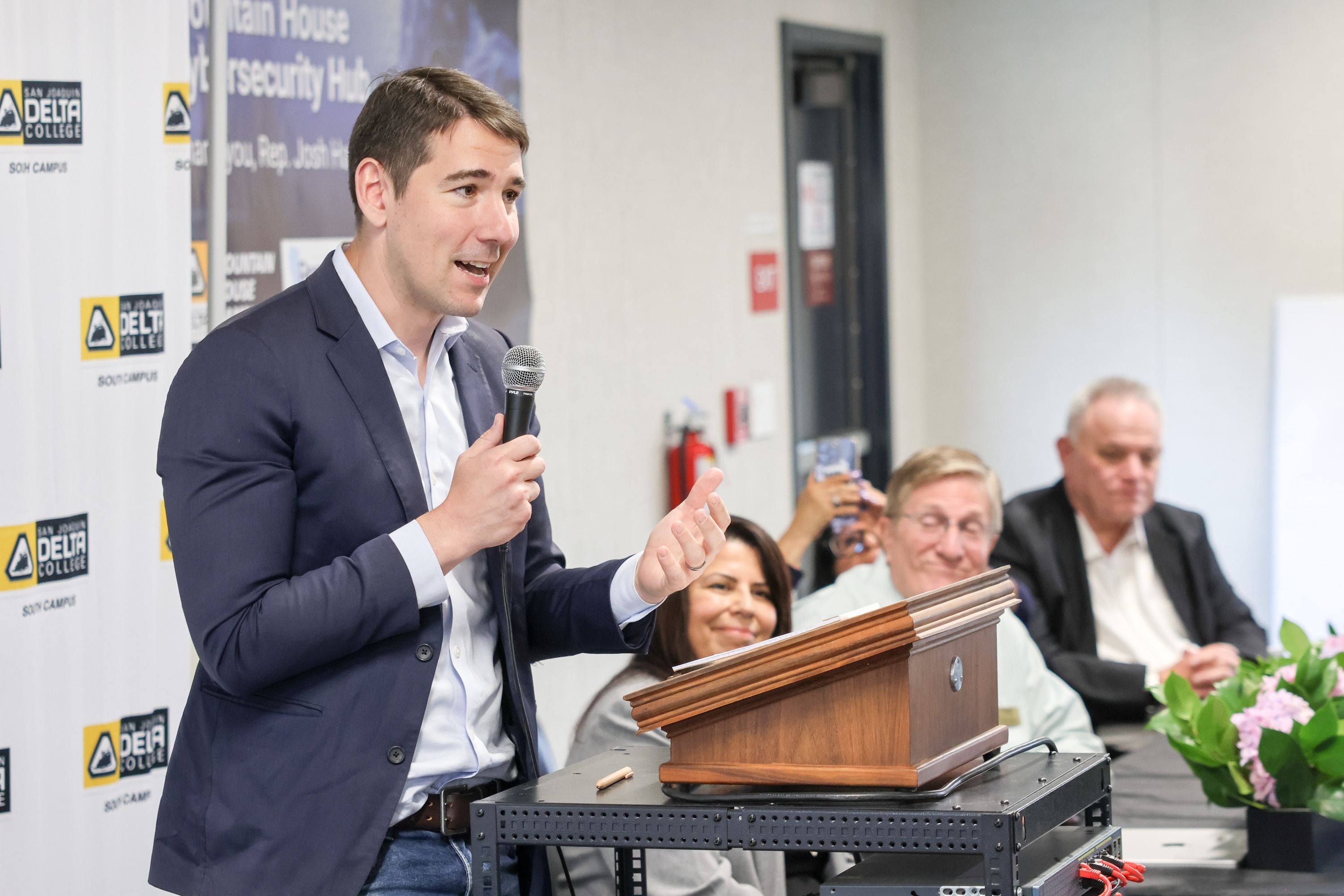 Photo of Congressman Josh Harder speaking at cybersecurity hub event