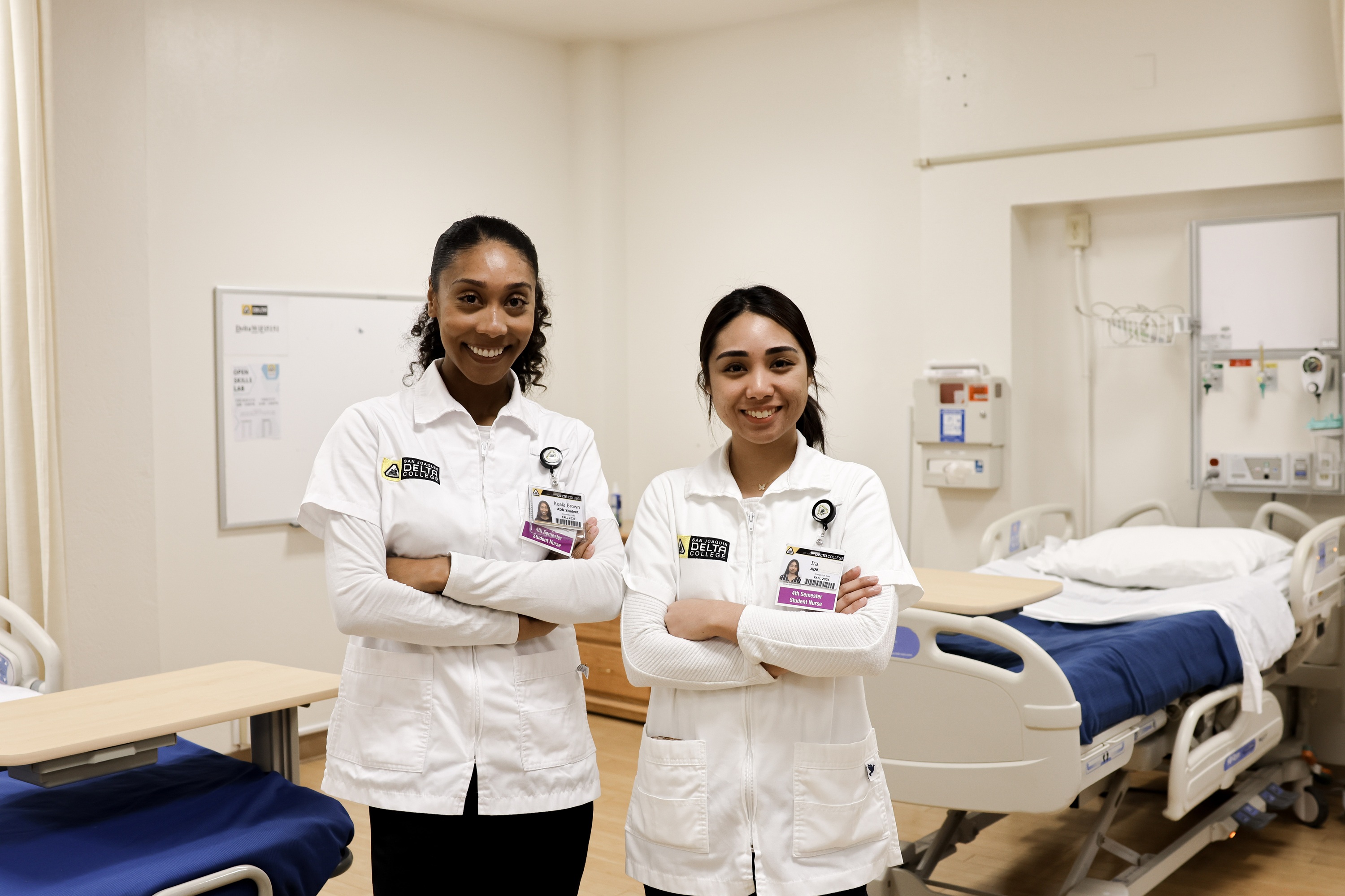 Photo of two nursing students in the simulation lab