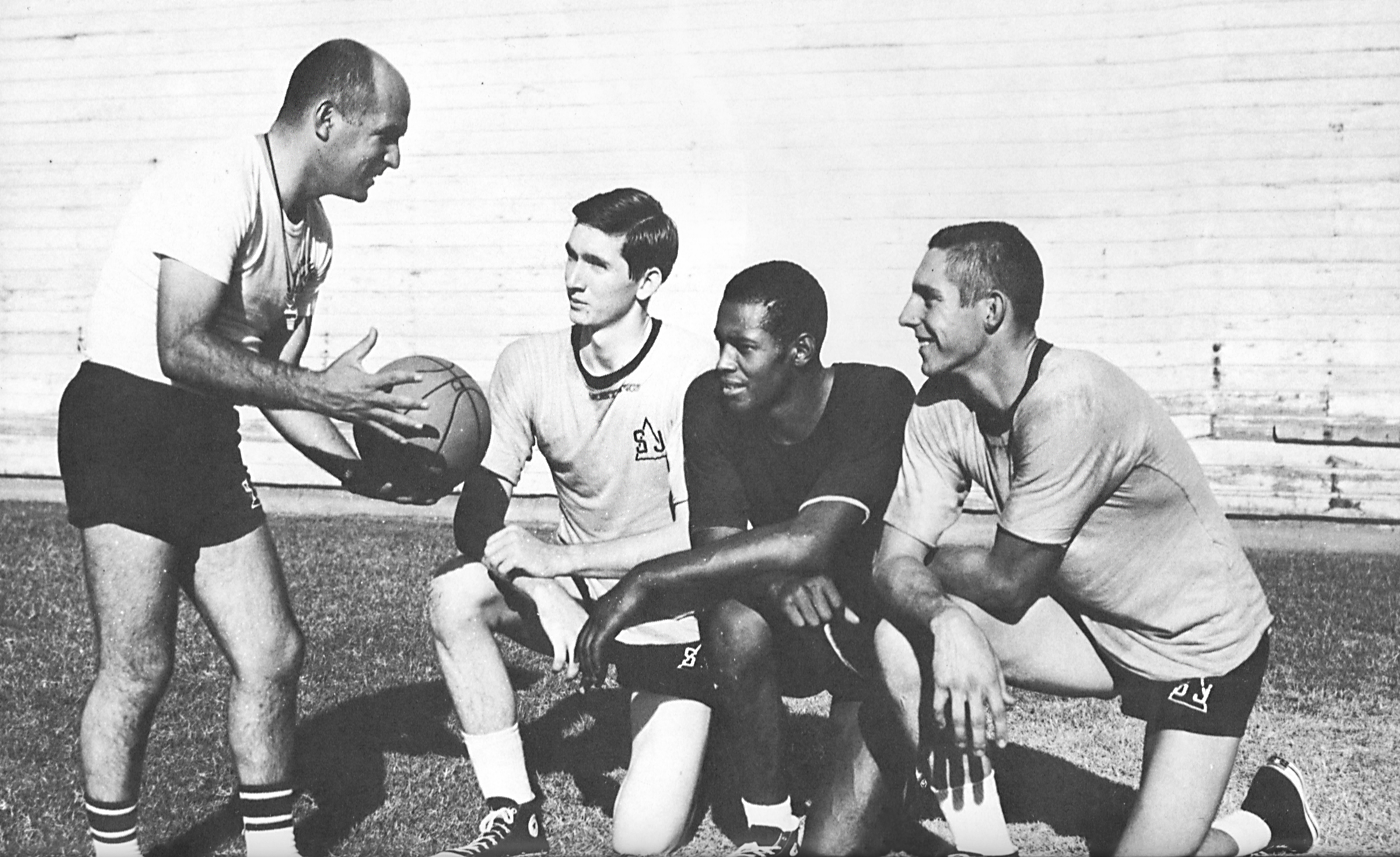 Ernie Marcopulos, left, coaching Delta basketball players in 1965