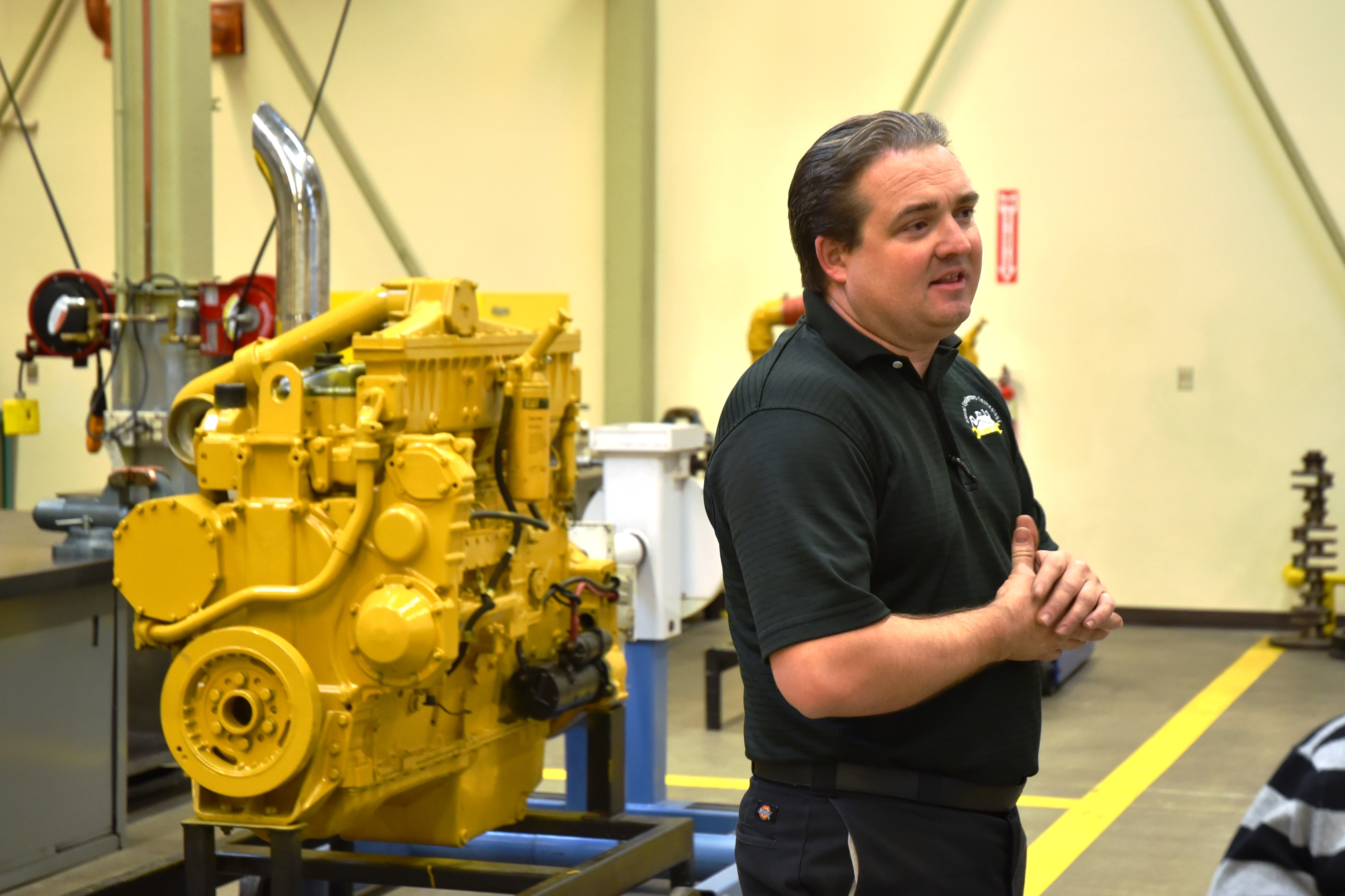 Caterpillar program faculty showed Chancellor Eloy Oakley some of the heavy equipment during his visit to San Joaquin Delta College.