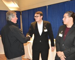 San Joaquin Delta College welding instructor Alex Taddei, left, shakes hands with students Cole Clark and Lorenzo Duenas after the Entree to Employment event. 