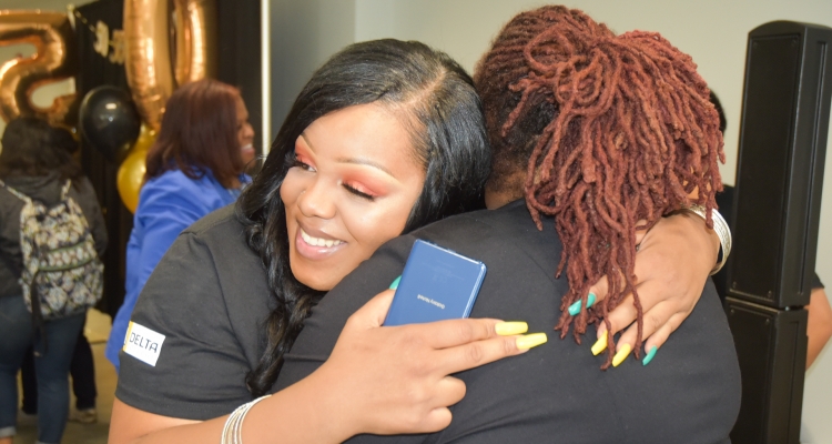 Se'Quoia Drew gets a hug from EOPS director Danita Scott at the 50th anniversary celebration for Delta's EOPS program. Se'Quoia Drew gets a hug from EOPS director Danita Scott at the 50th anniversary celebration for Delta's EOPS program.