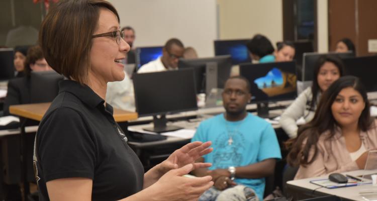 Professor Alicia Stewart addresses students and community members during the recent "GO LIVE with Top 25" event for job hunters