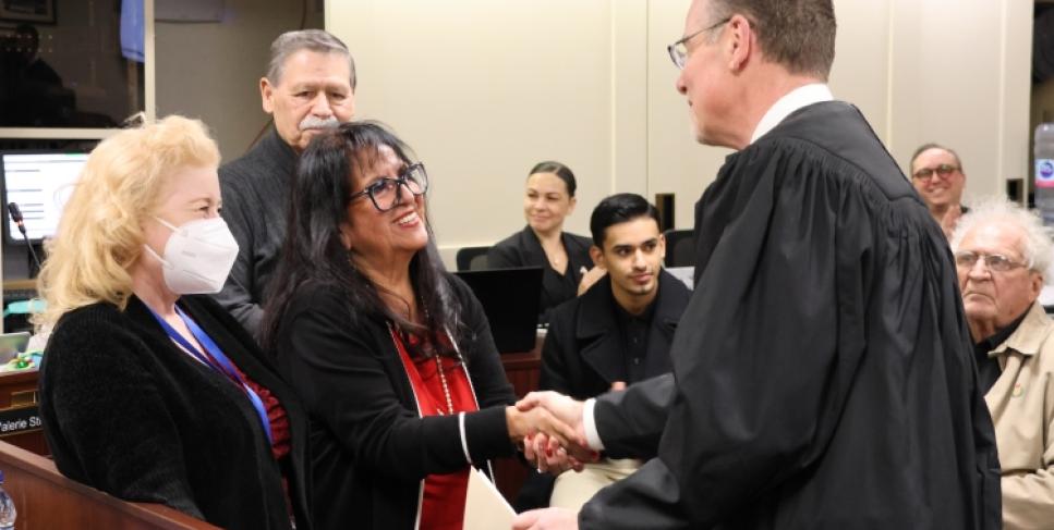 Trustees Catherine Mathis and Janet Rivera take the oath