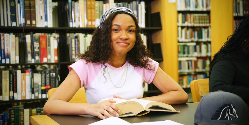 A student studies at the Delta College Library