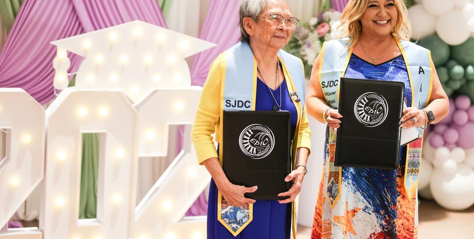 Photo of mother and daughter graduating from College