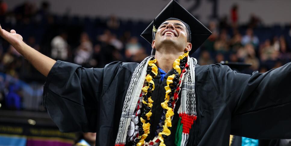 Photo of a student celebrating at Commencement
