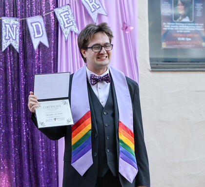 Photo of a student at Delta's Lavendar graduation celebration