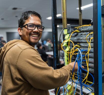 A student working with computers at Delta's Cisco Academy