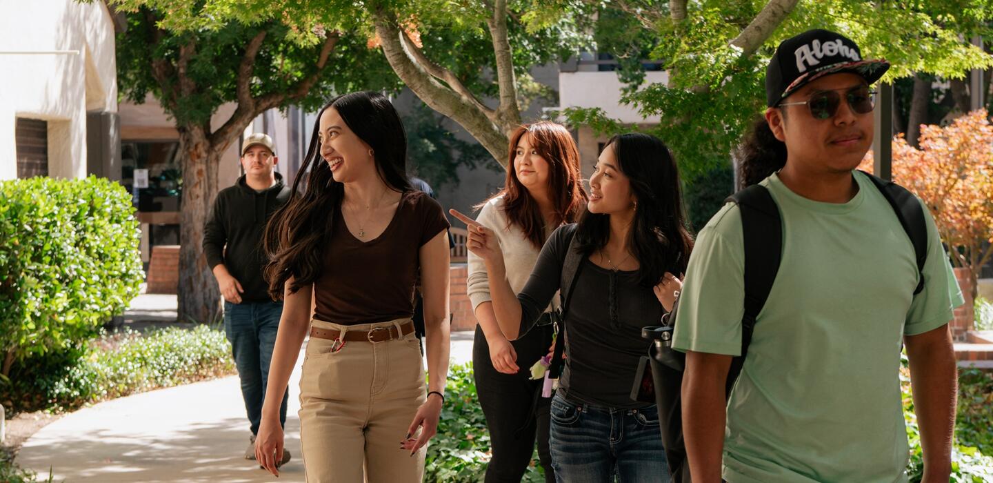 Delta students walking through a beautiful campus