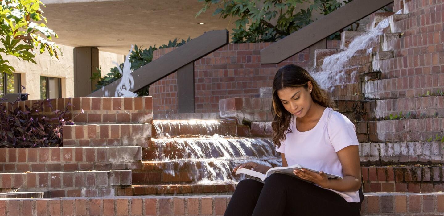 Student on Steps on Campus