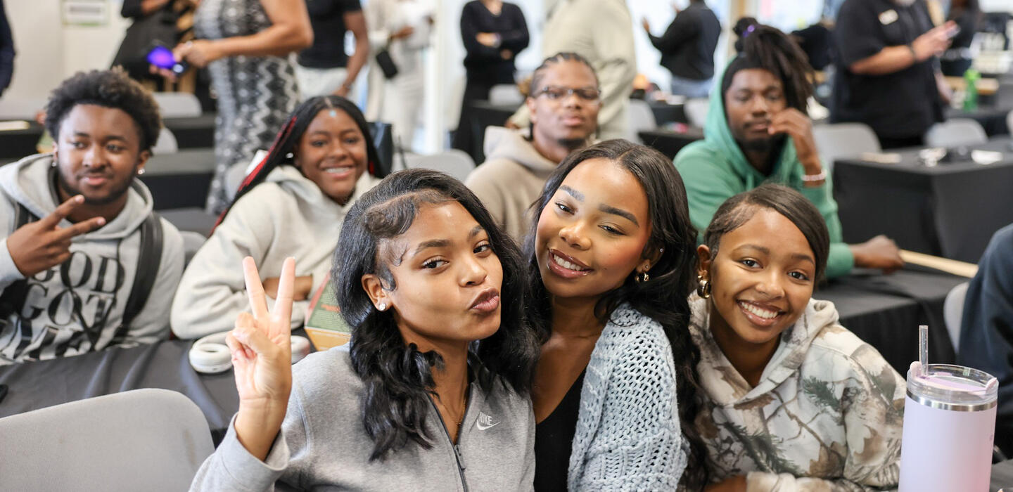 Photo of Umoja students smiling for the camera