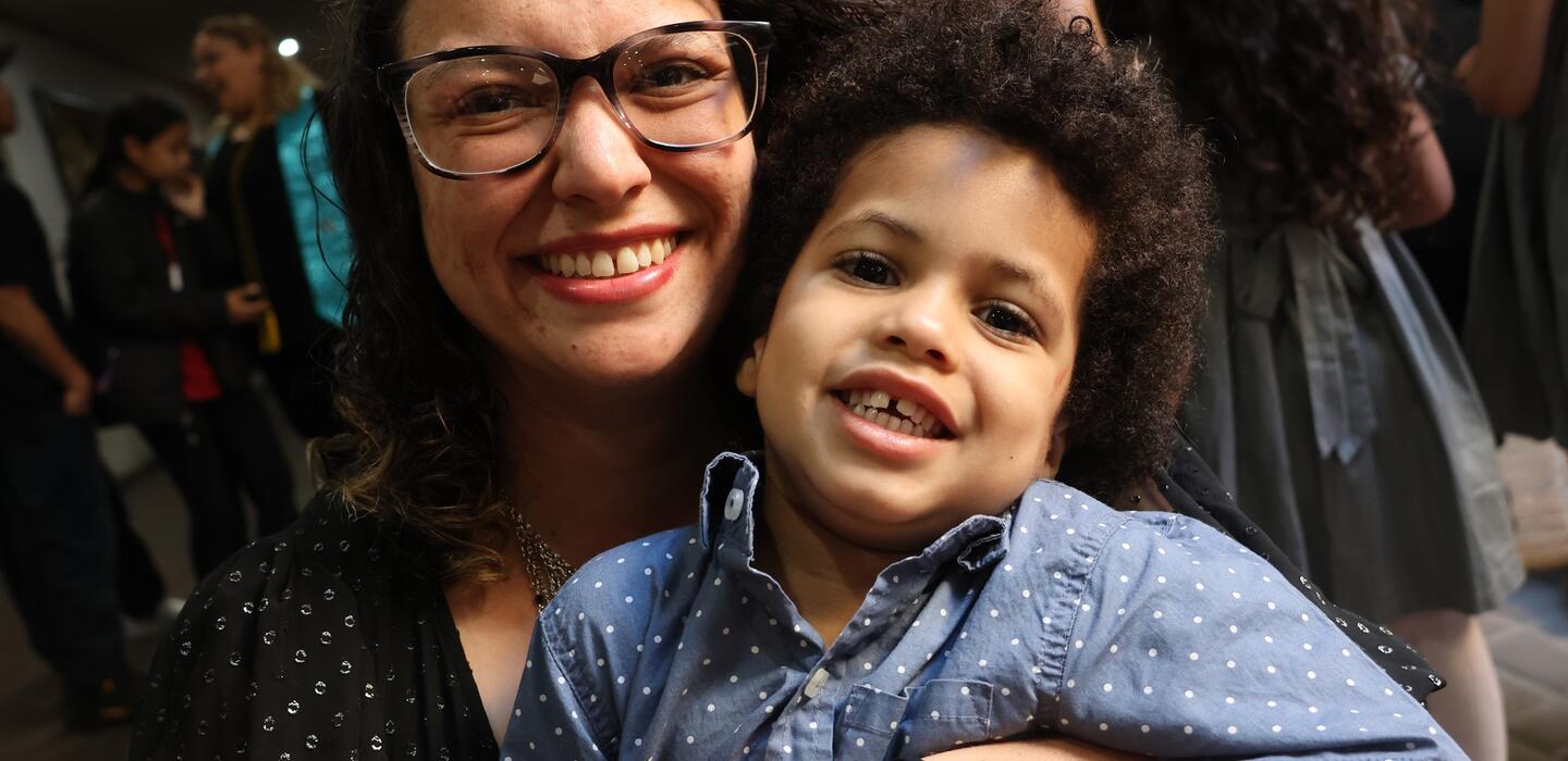 Photo of a student parent and her son