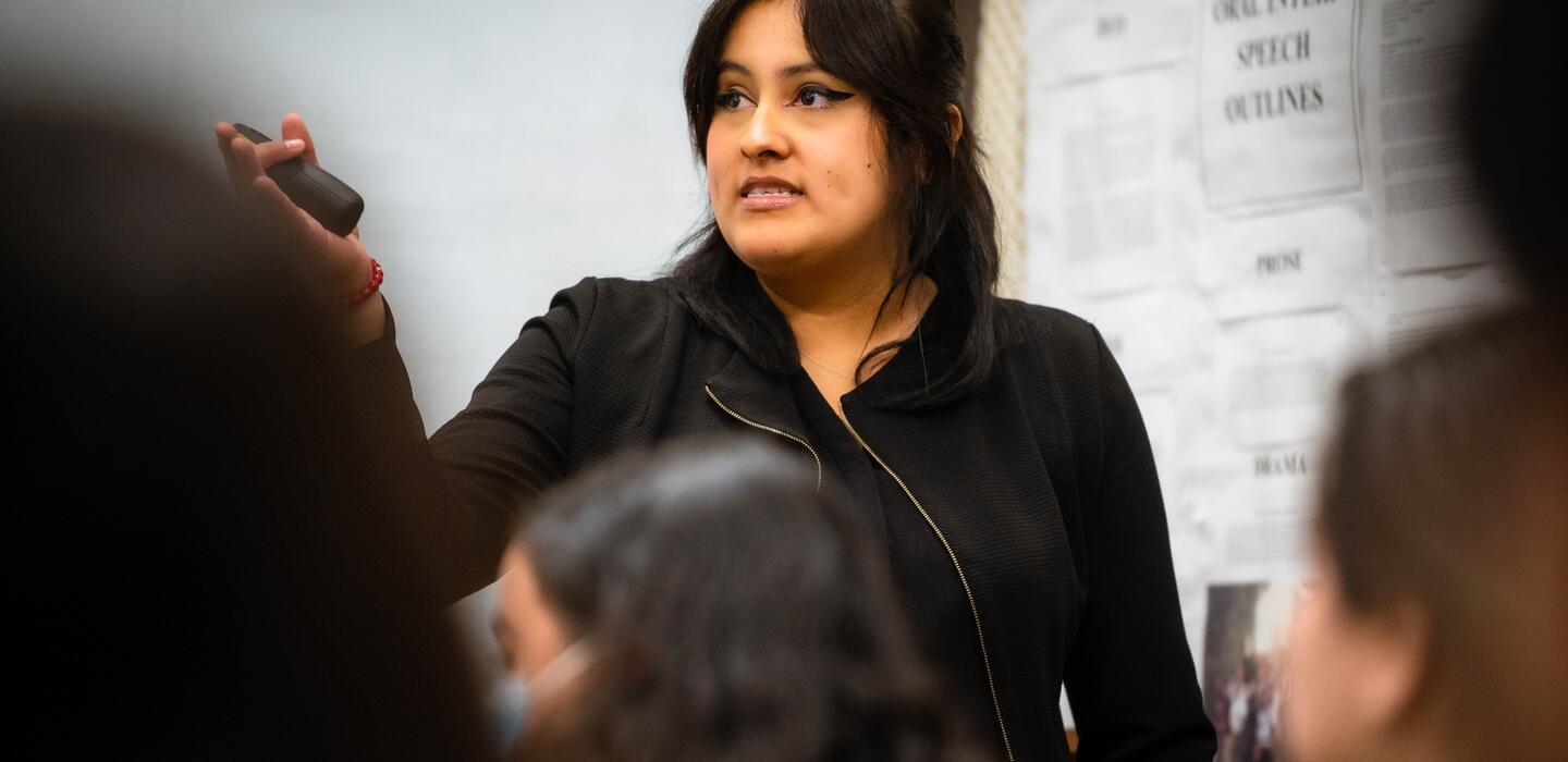 Photo of a student delivering a speech during their class