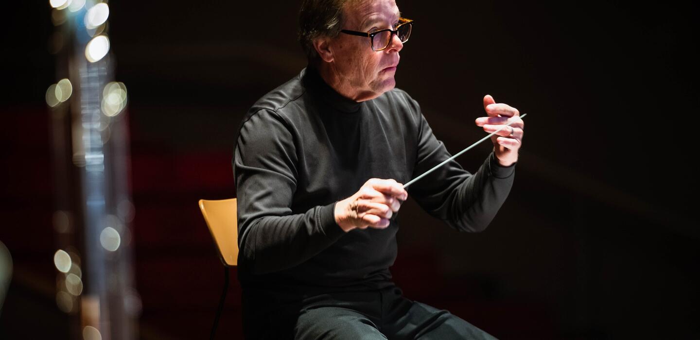 Photo of the band director at a concert