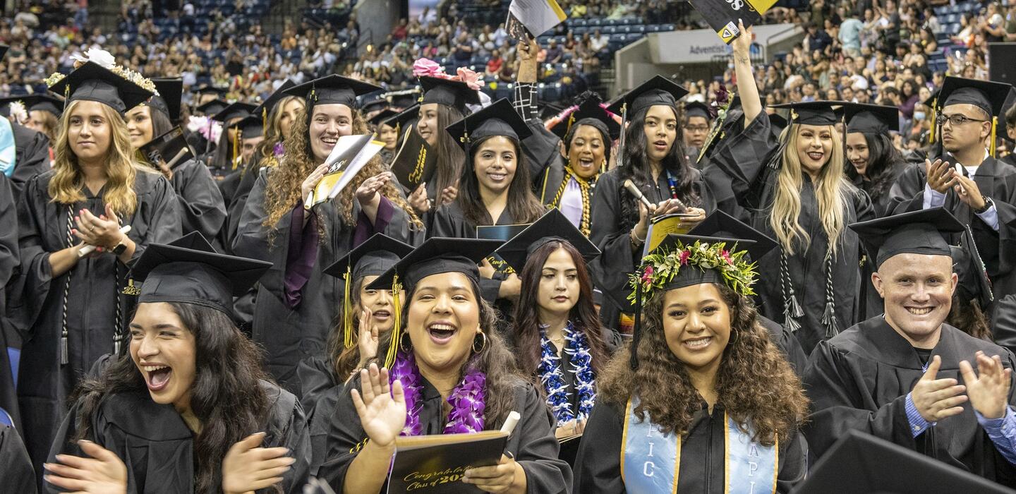 Photo of crowd of happy Delta graduates