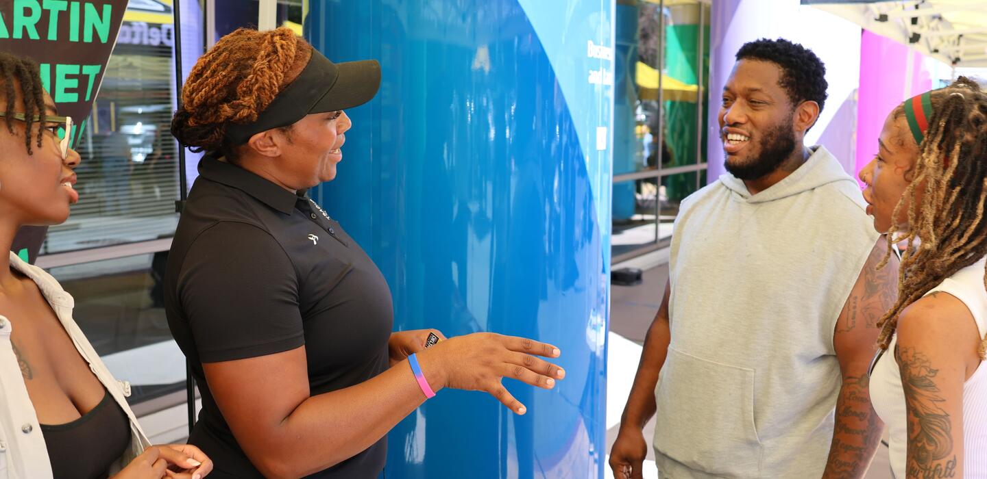 Delta College speaker engaging with a group of students at a Delta campus event