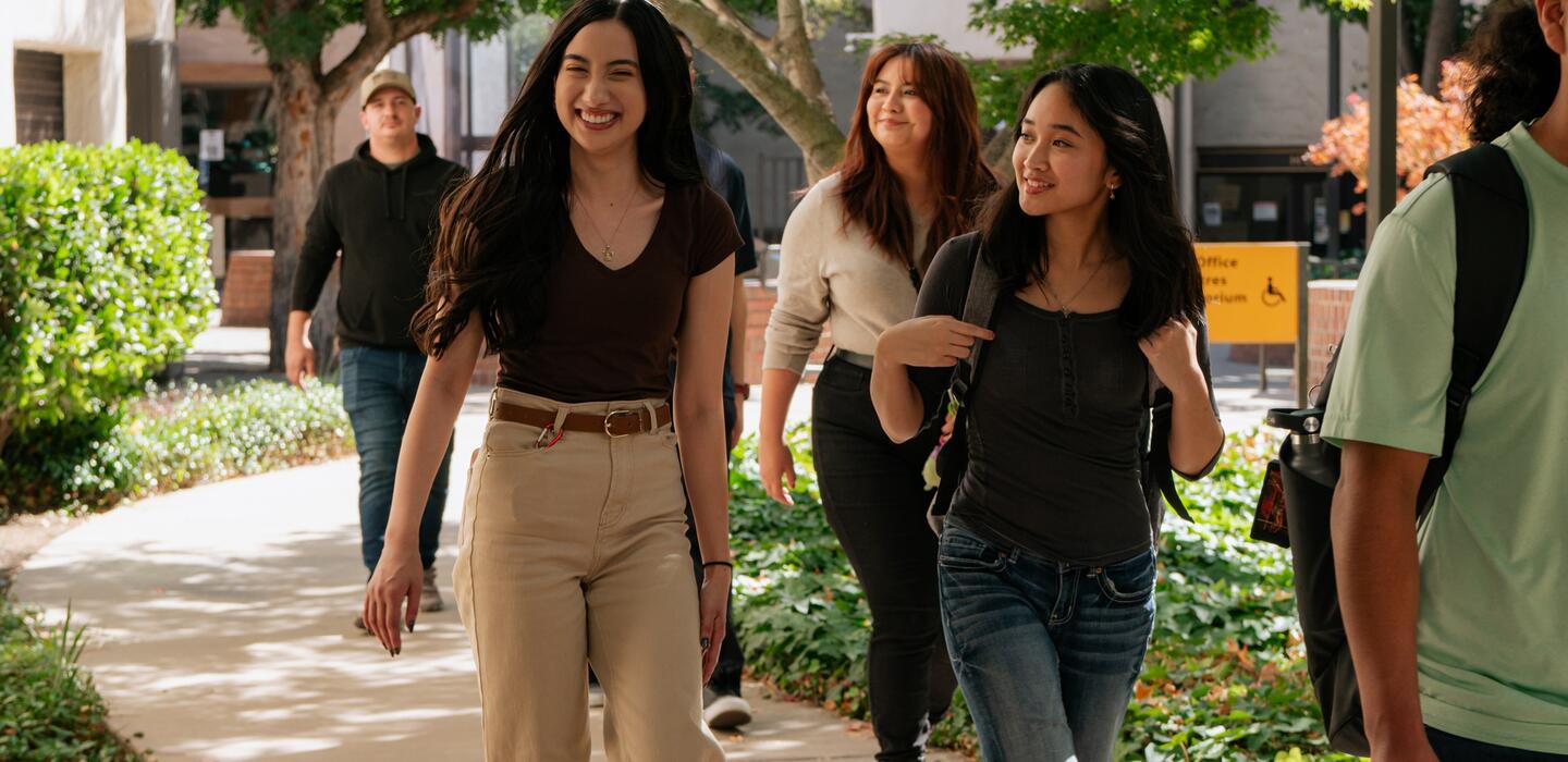 Photo of students walking through campus