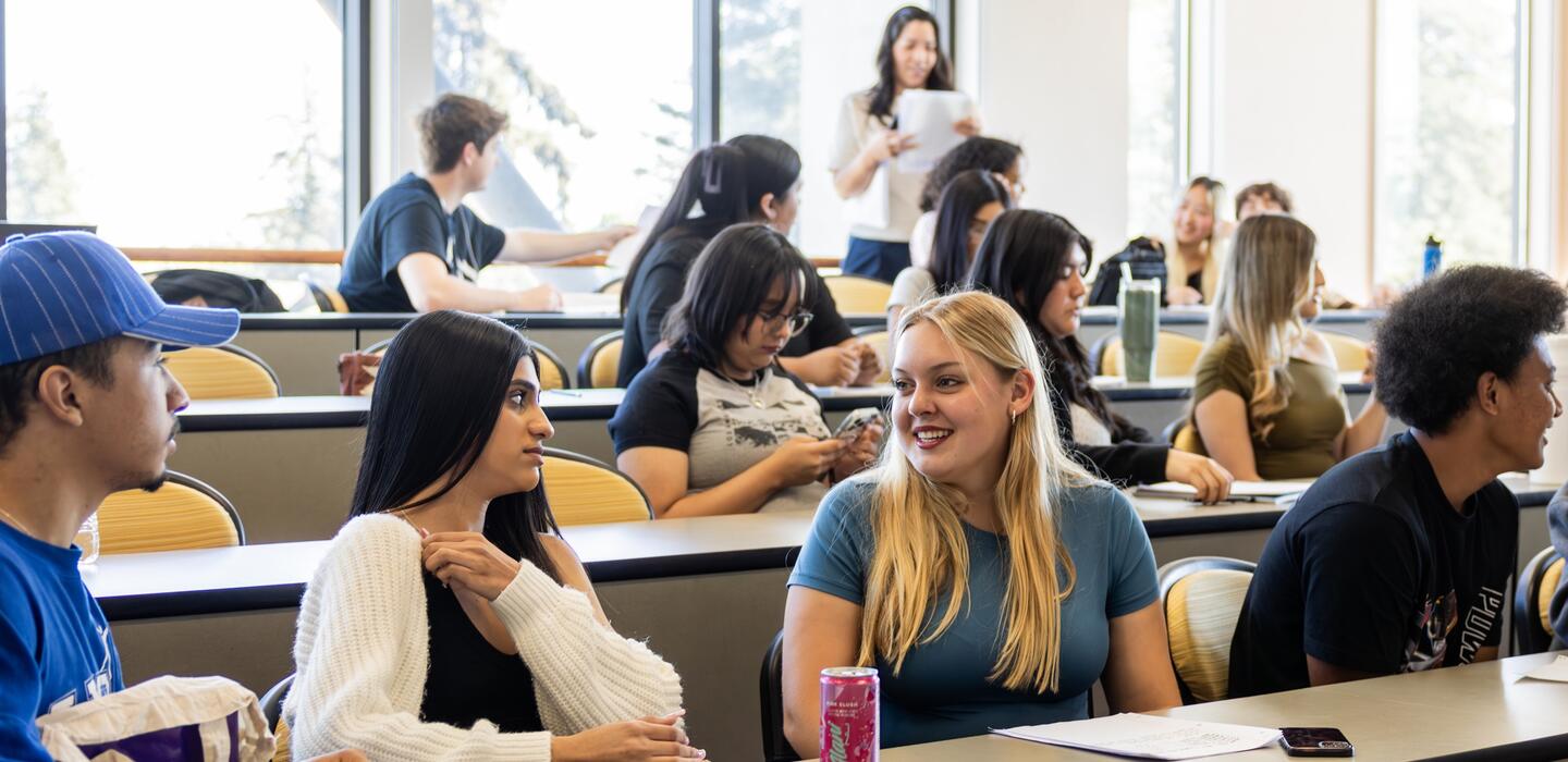 Photo of students talking during a sociology class