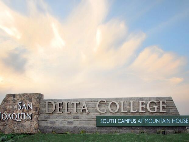 Delta College's Mountain House Campus entrance sign in front of clouds and sky