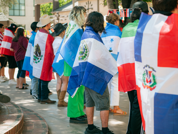people holding their flags