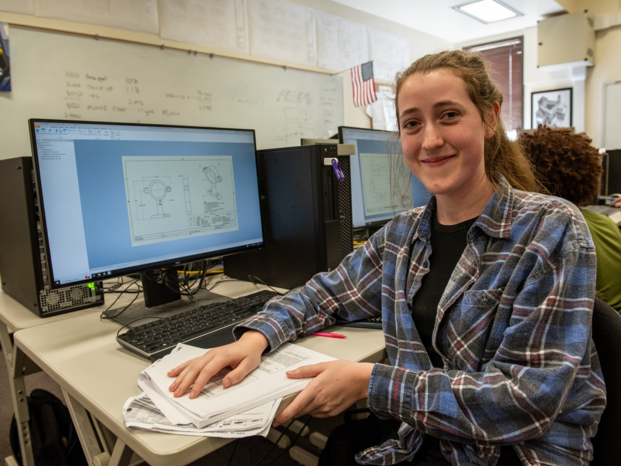 engineer in front of the computer creating 3d object