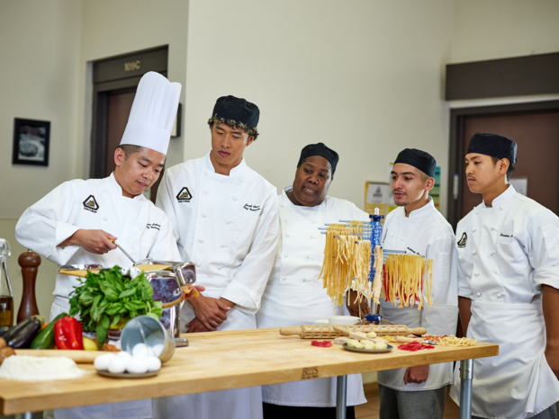 Chef showing how to process pasta