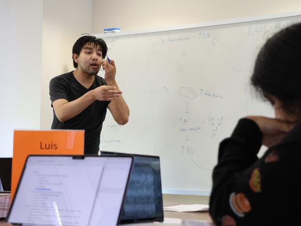 A Delta College tutor works with students