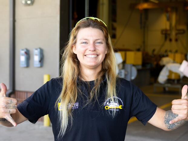 A Caterpillar student celebrates her graduation