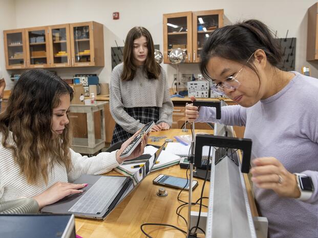 Physics students performing a lab exercise