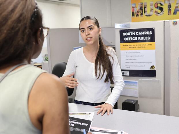 Two people talking in an office