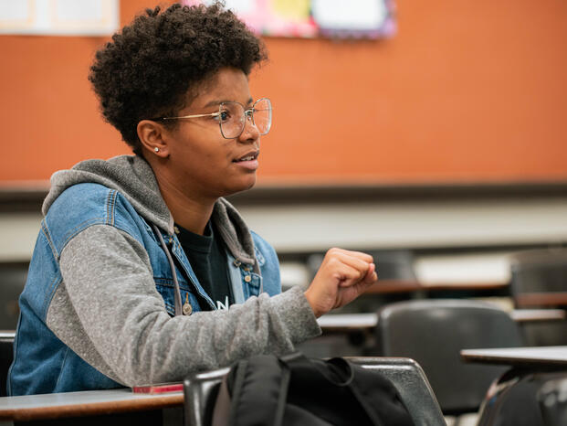 An ASL student communicates during class