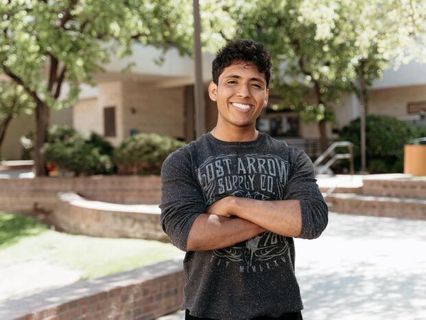 A Delta student smiles for the camera
