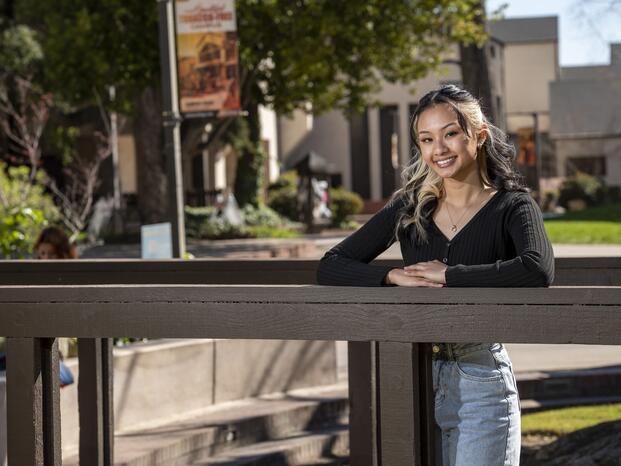 A student smiles on the Delta College campus