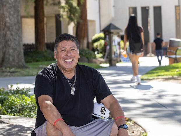A student veteran at Delta College smiles for the camera