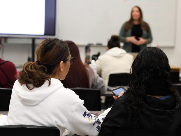 Students listen to their ESL instructor in class