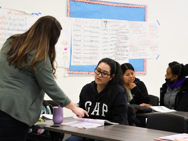 An ESL instructor works with a student