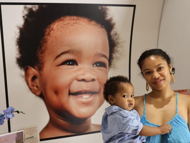 A Student Parent holding child