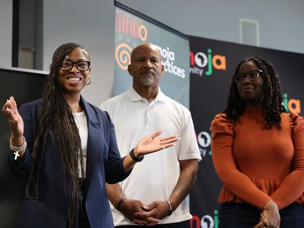 Delta College faculty members smiling at a recent Umoja event