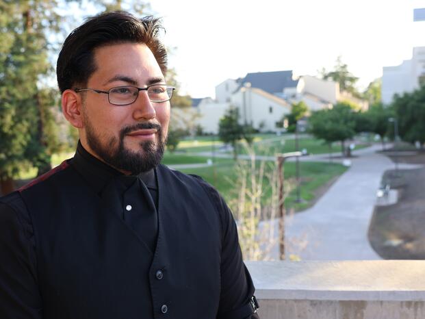 A student who graduated from the Phoenix Project poses for a photo